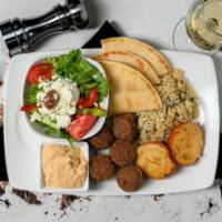 Falafel Platter (5 pcs) · Served with Spinach rice and Rosemary Red Potatoes.