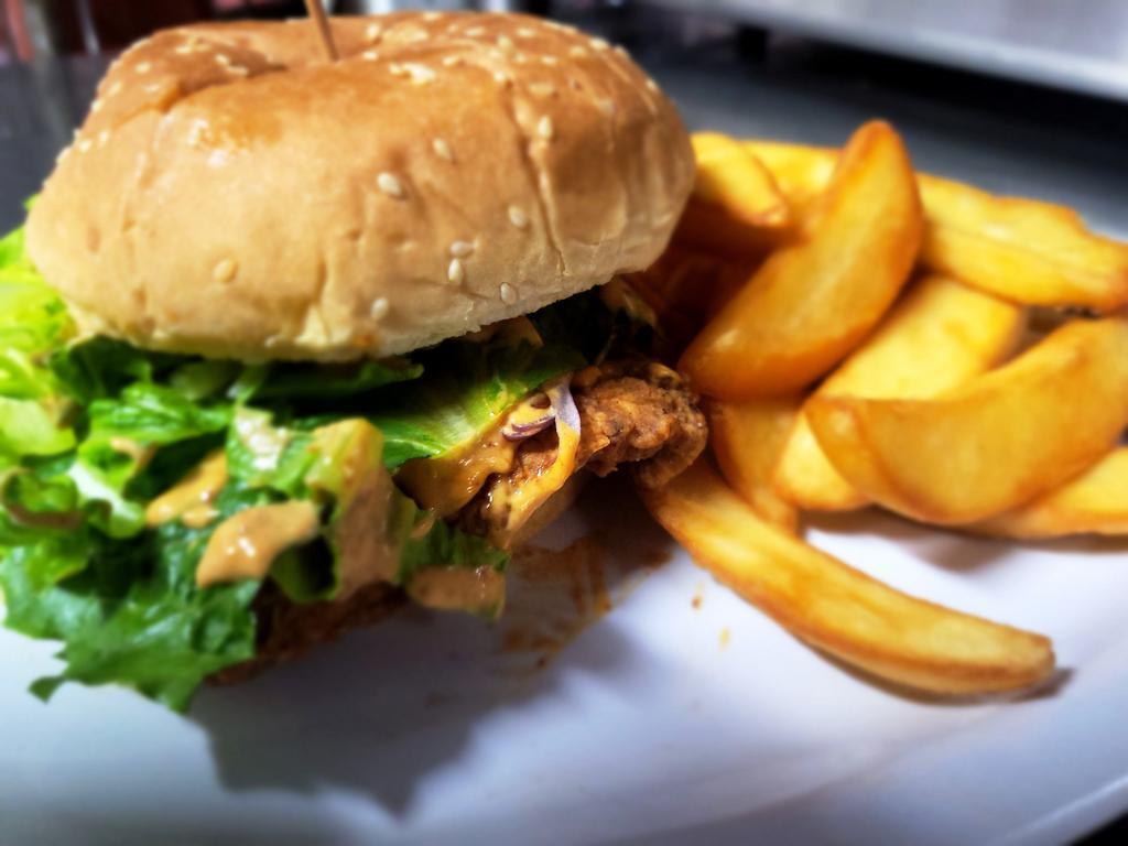 FRIED BONELESS CHICKEN BREAST · served with Fries, 1 sauce, lettuce, tomatoes