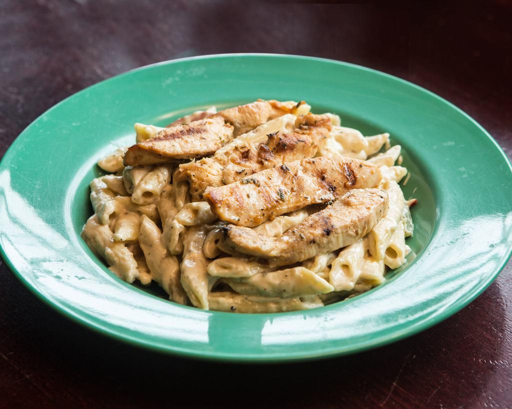 Rasta Pasta and Chicken · Pasta sauteed is a creamy coconut sauce mingled with grilled chicken.