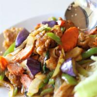 Spicy Catfish · This colorful stir-fry with eggplants, bell peppers, onions, and crispy catfish nuggets in a...