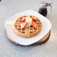 WAFFLES · Belgian waffle served with powdered sugar & topped w/ fresh strawberries