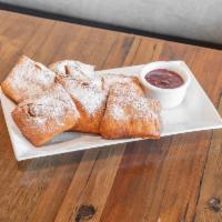 Beignets with Fresh Raspberry Jam · Fresh beignets, powder sugar dusted, with house-made raspberry jam.   House Specialty***