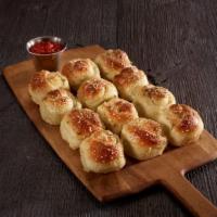 Garlic Knots · Vegetarian delights. Freshly baked and brushed with garlic, sesame seeds, and Romano cheese....