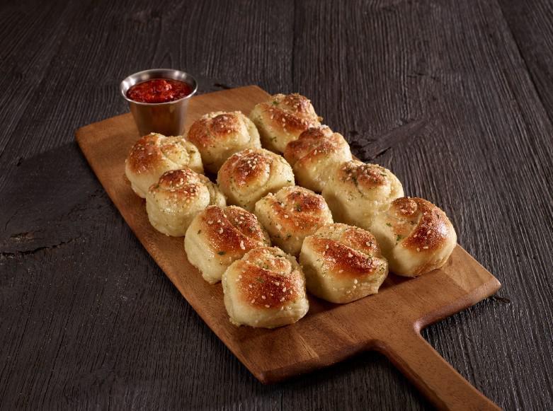 Garlic Knots · Vegetarian delights. Freshly baked and brushed with garlic, sesame seeds, and Romano cheese. Served with marinara sauce. 
 Add Alfredo sauce for an additional charge.