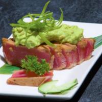 A13. Ahi Tuna Steak · Pan seared ahi tuna steak (rare inside) with Garlic shoyu topped with wasabi avocado mix.