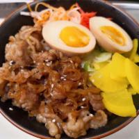 R1. Gyudon · Simmered toro beef and onion with house sweet soy sauce served over steamed rice with a side...