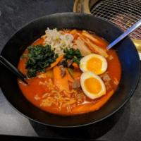 R8. House Spicy Ramen · Mild spicy beef broth, soft-boiled egg, choice of meat and assorted vegetable.