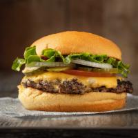 The Juicy Smashed Burger · Potato bun, 4 oz. juicy black Angus meat, American cheese, farm fresh lettuce, tomatoes, pic...
