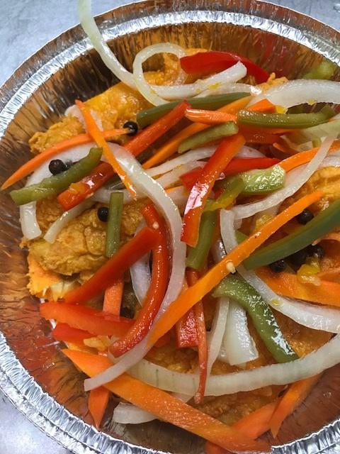 Escoveitch Whiting Fish · Lightly fried, topped with a pickle of scotch bonnet pepper, bell peppers and onions.
