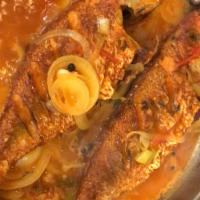Brown Stew Red Snapper (whole) · Lightly fried and sauteed in a traditional brown stew gravy.  served with choice of white ri...