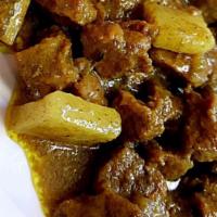 Dinner Curried Goat · Seasoned with a specialty blend of herbs & spices, simmered in curry gravy.