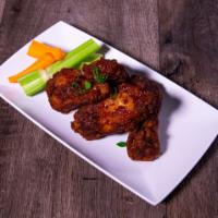 Wings · Crispy fried chicken wings tossed in a sauce of your choice: Nashville hot, garlic Parmesan,...