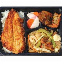 Breaded Swai Filet Bento Bx · Served with Pancit Bihon, Fish Fritters, Pickled Radish, and Rice.