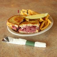 Dinty Moore Sandwich · A classic triple-decker. Corned beef, Swiss cheese, cole slaw and Thousand Island dressing o...