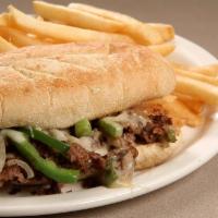 Philly Cheese Steak Sub · Shaved steak with grilled onions, peppers, and Swiss cheese.