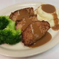 Baked Meatloaf · Made from our own special recipe of ground beef and spices, topped with savory beef gravy. S...