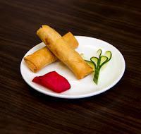 A02. Spring Roll 素春卷  · 2 pieces. Cabbage, shiitake and carrot stuffing. Vegetarian.