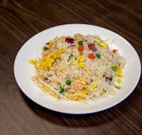 R02. House Special Fried Rice 本楼炒 饭 · Stir-fried with shrimp, chicken, roast pork, green bean sprout, pea, carrot, and onion.