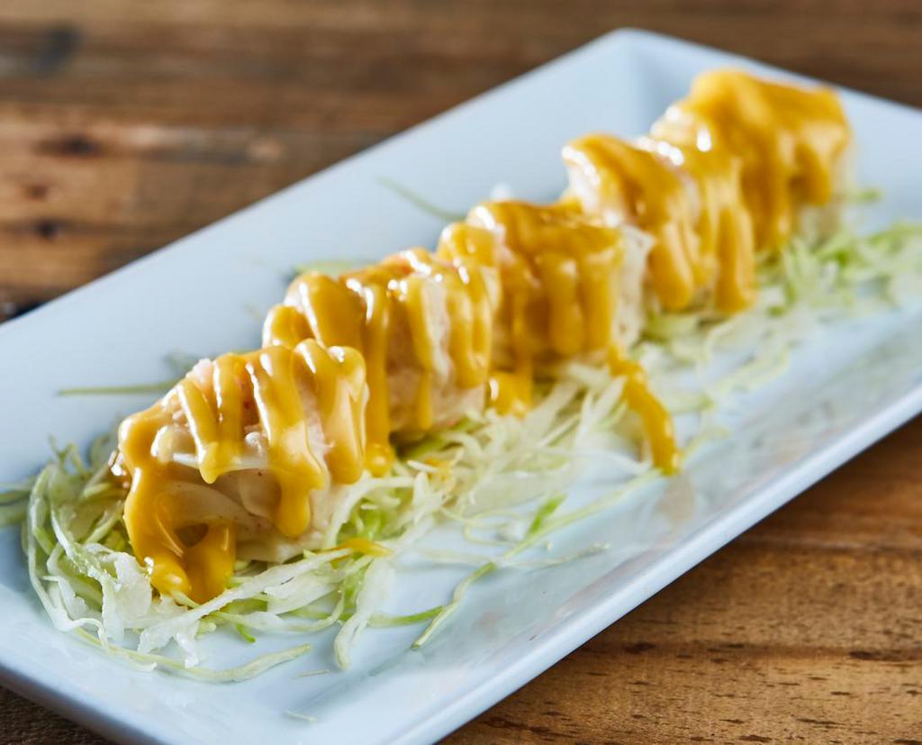 Crab Shumai · Steamed Crab Shumai / Sliced Cabbage on bottom
Mango Sauce On the Side
