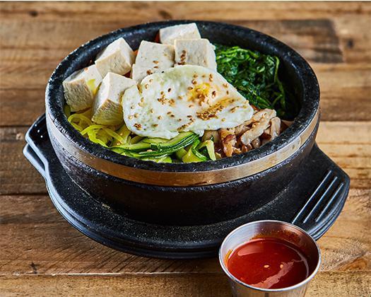 Tofu Bibimbap · Steamed Tofu on top / Steamed Rice served with Cooked vegetables (Carrot, Spinach, Zucchini, Mushroom, Pickled Radish
Egg Yolk, Sesame Seed on top  //  Red Pepper Paste On the Side
*** Delivery - Fried Egg ***