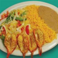 Grilled Shrimp Plate · 8 large shrimp, grilled on the shell with butter and a special spice blend. Served with rice...