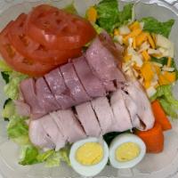 Chef Salad · Romaine lettuce, ham, turkey, Swiss, Cheddar, tomatoes, carrots, cucumber, broccoli, 1/2 har...