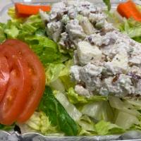 Chunky Chicken Salad Plate · Romaine lettuce, chicken salad, tomatoes, and carrot stick. The house dressing is homemade g...