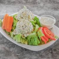 Tuna Salad Plate · Romaine lettuce, tuna salad, tomatoes, and carrot stick. The house dressing is homemade garl...