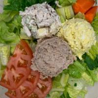 Trio Salad · Romaine lettuce, chicken salad, tuna salad, egg salad, tomatoes, and carrot stick. The house...