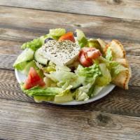 Greek Salad · Includes pita. Add meat for an additional charge.
