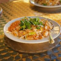 61. Noodle Delight with Chicken · Flat rice noodles pan-fried with chicken, egg, green onions, bean sprouts and ground peanuts...