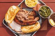 City Sampler with 2 Pint Sides · Brisket, pulled pork, sausage, turkey, two pint sides, Texas toast. (Feeds 1–2)
