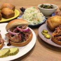 Family Pack · One pound of pulled pork, buns, two pint sides, and cornbread for two adults and two kids.