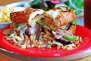 More Cowbell · Brisket or turkey, topped with peppers, provolone, onions, and creamy horseradish sauce on T...