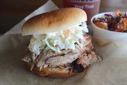 LoLo's Pulled Pork with Slaw · Marinated in Swine Wine, topped with creamy slaw.