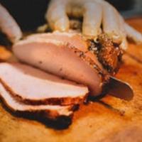 Smoked Turkey Breast with Two Sides · Hormone-free turkey breast, rubbed with salt and pepper and smoked to perfection