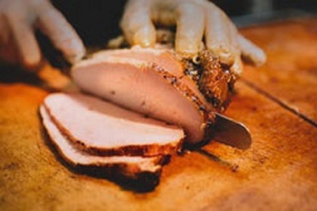 Smoked Turkey Breast with Two Sides · Hormone-free turkey breast, rubbed with salt and pepper and smoked to perfection