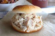 Pulled Chicken with Two Sides · Smoked chicken, pulled from the bone and mixed with scratch-made 'Bama sauce
