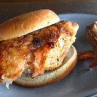 Smoked Chicken Sandwich · All-natural chicken breast, filleted by hand and served on a bun (with the wing on the side)