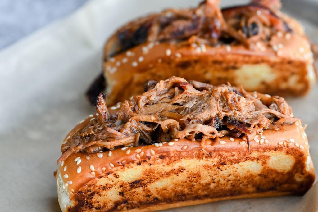 Chipotle BBQ · Pulled pork, beef brisket, and rib meat, mixed together in a sweet and spicy housemade sauce and served on buttery grilled Texas toast.