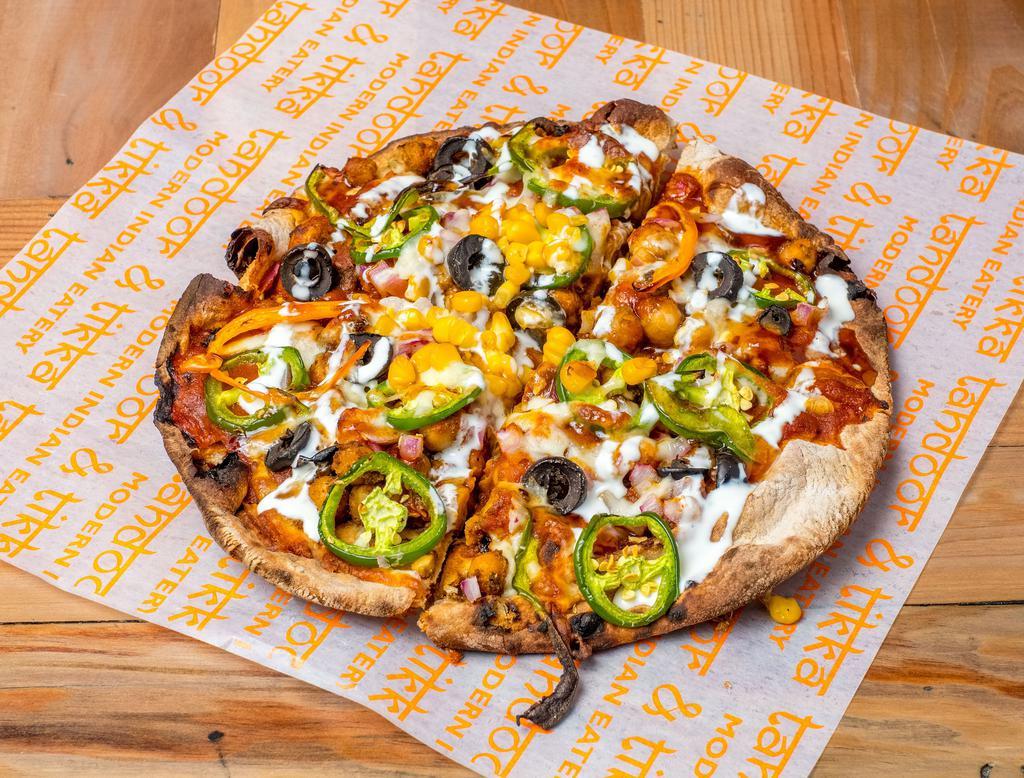 Paneer Naan Pizza · Fresh Naan base, flavored with a curry of your choice, and topped with your favorite fresh veggies of your choice and mozzarella cheese! Sauce it to your taste buds!