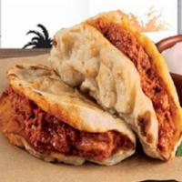 Curried Chicken Naanwich · Fresh baked naan as the bread, topped with cooked to perfection curried chicken, flavor it w...