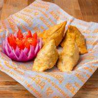 Chicken Samosas Chaat Style · Made from scratch pastry filled with marinaded minced chicken, topped with Chana Masala (Chi...