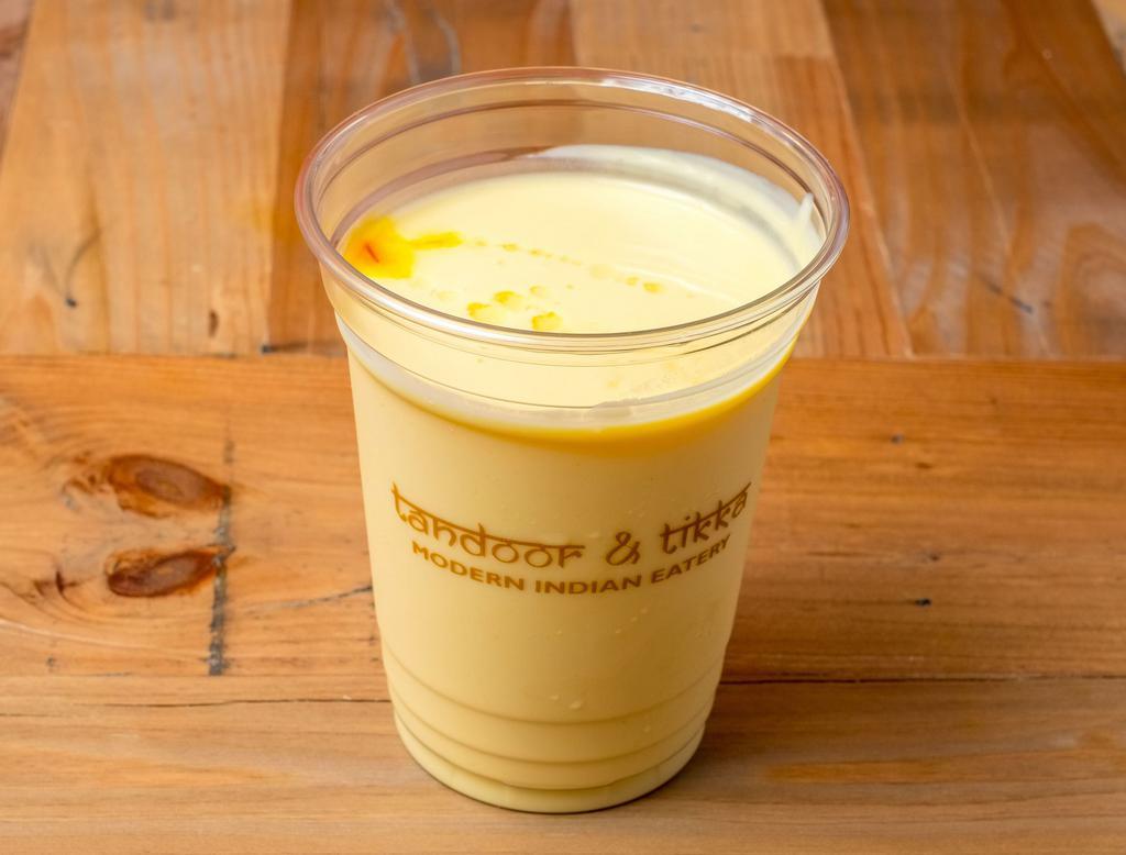 Mango Lassi · Made from scratch, mango Lassi is a perfect balance of sweetness and flavor! Similar to a smoothie, slightly richer in texture. Perfect to add-on with any meal!