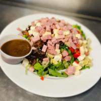 Chopped Antipasti Salad · Romaine lettuce diced with imported meats and cheeses, roasted peppers, marinated eggplant, ...