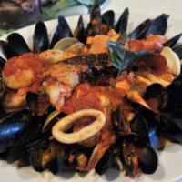 Mediterraneo Dinner · Shrimp, calamari, mussels, clams, pieces of the catch of the day, and lobster tail over ling...