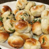 Garlic Knots · Six garlic knots served with a side of marinara.