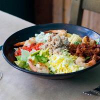 California Seafood Cobb Salad · Mixed greens topped with applewood smoked bacon, shrimp, blue crab claw meat, tomatoes, avoc...