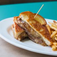 The Texas Melt · 1/2 lb. of Ground Certified Angus beef smothered in cowboy candy and swiss cheese, served on...