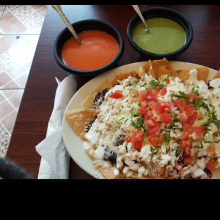 Nachos · Tortilla chips topped with refried beans and melted cheese.